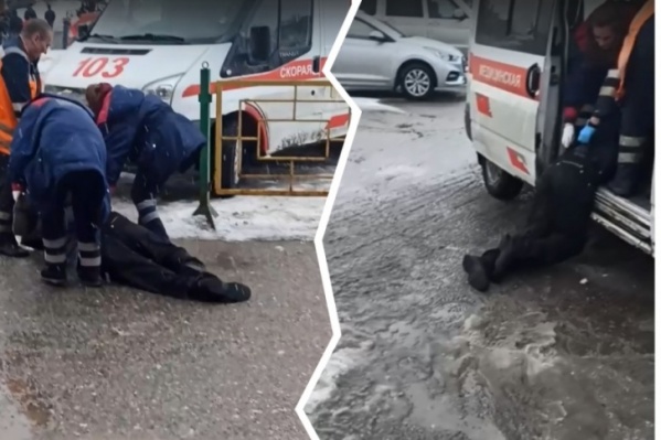 Пациента тащили к машине скорой помощи по земле Пациента тащили к машине скорой помощи по земле