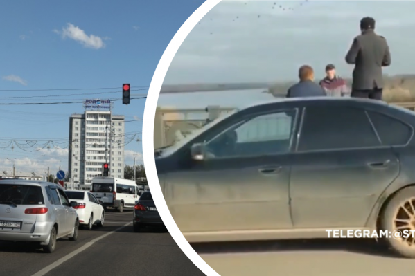 Неизвестный мужчина перелез за ограждения на Коммунальном мосту и грозился спрыгнуть Неизвестный мужчина перелез за ограждения на Коммунальном мосту и грозился спрыгнуть