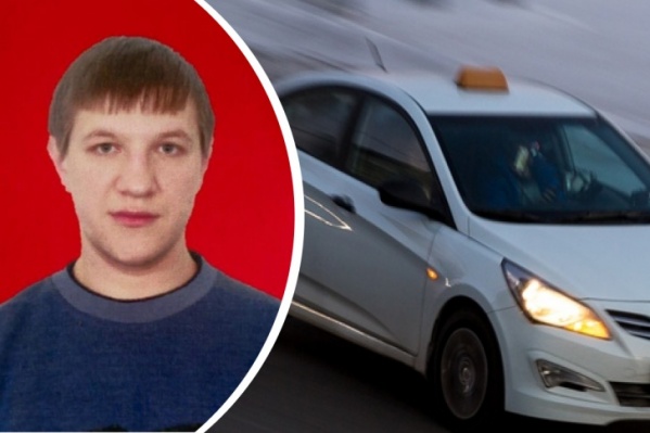 Таксист работал на своем автомобиле Таксист работал на своем автомобиле