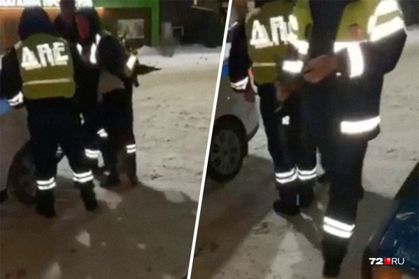 Кадр из видео, где молодого человека скручивают сотрудники ДПС Кадр из видео, где молодого человека скручивают сотрудники ДПС