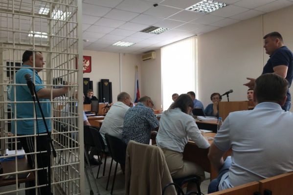 Для Сергея Гудованого (слева в клетке) обвинение запросило самый большой срок лишения свободы Для Сергея Гудованого (слева в клетке) обвинение запросило самый большой срок лишения свободы